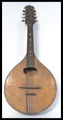 A vintage 20th Century eight string acoustic mandolin, mother of pearl inlays to the fretboard /