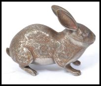 A 19th century cold painted metal Chinese figurine of a hare / rabbit having silver overlaid chase