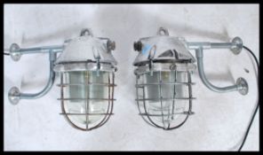 A pair of Industrial ' extreme condition ' heavy industrial bulkhead lights. Each with glass pendant