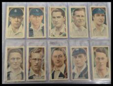 An album of vintage cigarette cards mainly full sets to include Ardath cricket tennis and golf