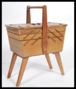 A vintage unusual shaped 20th century retro metamorphic sewing box having ebonised movements. The