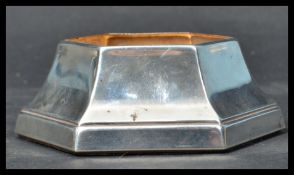 A sterling silver hallmarked inkwell base by Carrs of Sheffield. The inkwell of hexagonal form.