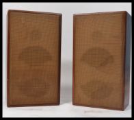 A pair of vintage early 20th century Art Deco wooden cased speakers of upright rectangular form with