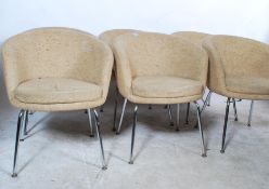 A set of six retro 20th Century tub dining chairs retaining original woollen covers raised on chrome