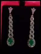 A pair of sterling silver Art Deco style earrings of twist form set with marcasites and green