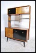 E Gomme for G-Plan, a 1950's mid century room divider, with shelf and cupboard arrangement above a