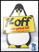 A vintage 20th century Shell advertising board In the form of a penguin with notation to centre. The