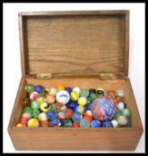 A group of marbles dating from the 19th century to include a large Victorian onion skin example.