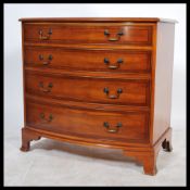 A contemporary Regency revival bow fronted mahogany chest of drawers, fitted with four stencil lined