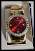 INGERSOLL GEMS WRISTWATCH. Boxed, Ingersoll gems red faced date dial wristwatch with gem encrusted