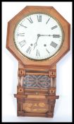 A 19th century Victorian inlaid walnut drop dial wall clock, twin train movement striking on bell