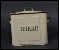 A vintage early 20th century enamel bread bin of rectangular form having a sarcophagus lid with