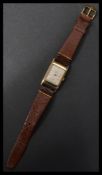 A 9ct gold Buren vintage 20th century tank style wrist watch. Dial signed Buren Grand Prix J W
