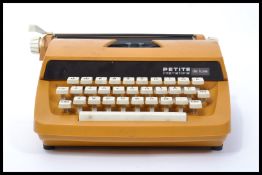 A retro 20th century vintage Petite International typewriter of decorative form complete with the