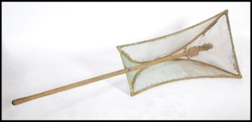 A vintage 20th century Elvers ( young eels ) net, the unusual shaped net supported by the long