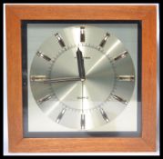 A vintage retro 20th Century teak cased Quartz wall clock by Toshiba. Measures 31.5 cm high and 31.5