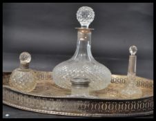 A silver hallmarked collared cut glass decanter along with two silver hallmarked collared perfume
