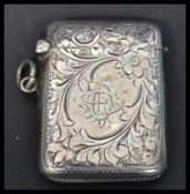 A silver hallmarked vesta case having a chased rococo design. Hallmarked for Birmingham 1901. Weighs