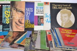 A collection of vinyl Long Play Lp record albums mainly Rock and Roll to include Rick Nelson, Elvis,