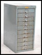 A vintage / retro 20th Century industrial ten drawer metal filing cabinet in original finish with