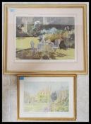 A framed and glazed print of a garden scene being signed in pencil by the artist to the margins