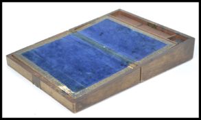 A Victorian 19th century oak and brass / bonrze mounted writing slope. Appointed interior with glass