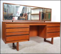 A vintage retro 20th century teak dressing table sideboard by William Lawrence raised on tapered