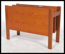 A 1970's Danish teak wood retro magazine rack - canterbury by Guy Rogers. The panelled body with
