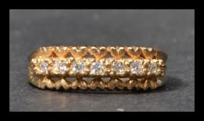 A hallmarked 9ct gold half eternity ring set with 7 white stones. Hallmarked Birmingham. Weight 2.