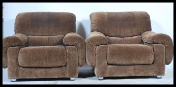 A pair of vintage retro G-Plan 'saddle ' style armchairs in the manner of Kofod Larsen. Each