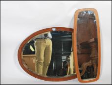 A vintage 20th century retro teak frame less wall mirror along with an Edwardian inlaid mahogany