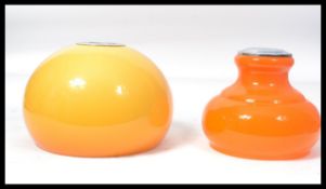Two vintage 20th century retro lamp shades / ceiling lights one being a tapered orange glass example