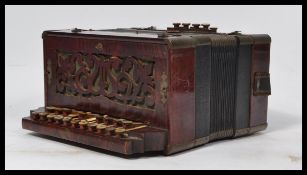 A vintage 20th century squeeze box accordion by Superba having mother of pearl buttons. Measures