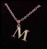 A sterling silver M initial pendant on sterling silver necklace complete in jewellery presentation