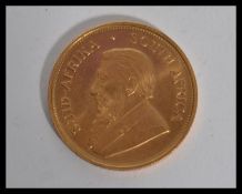 A 1974 South African Krugerrand gold coin. Weighs 33.93 grams. 1oz fine gold coin.