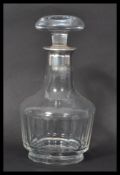 A German silver topped glass decanter having faceted glass body with mushroom glass stopper.