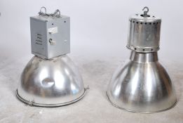 A pair of large industrial vintage mid 20th century aluminium ceiling lights of domed circular down
