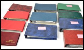 A large collection of vintage 20th century FDCs first day cover stamps held within 11 albums.