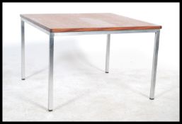 A late 20th Century vintage industrial teak wooden topped coffee / side table raised on a squared