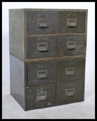 A pair of vintage 1950's industrial metal four  drawer office desk top filing cabinets in green, the