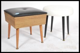 A retro mid century circular footstool being raised on ebonised dansette style turned legs with