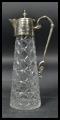 A vintage 20th century silver plated and cut glass claret jug. The cut glass body having silver