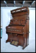 A late Victorian 19th century chapel harmonium organ. The case with simple carved detail, moulded