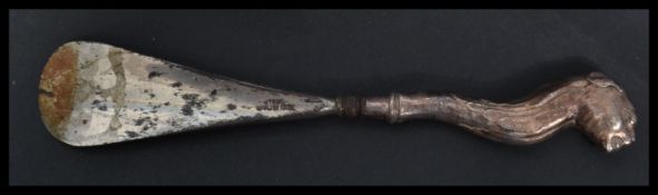 An early 20th century silver hallmarked novelty shoehorn shoe horn by Crisford & Norris Ltd