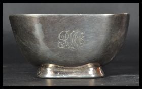 A silver hallmarked heavy peanut / bon bon dish of square form by H Atkin Brothers raised on