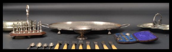 A collection of silver plate wares to include a Mappin and Webb dish , toast rack , salver etc.
