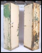A pair of vintage 1940's Industrial military metal locker cabinet having green military paint. The