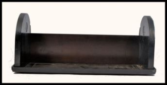 An early 20th Century Art Deco collapsible bakelite book trough / tidy. Makers mark for EBCO in