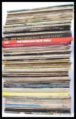 A collection of vinyl LP's to include the Beatles and the Rolling Stones along with other titles and