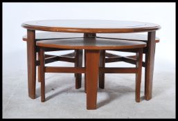 A vintage / retro 20th Century teak wood circular coffee table having drop centre glass top with
